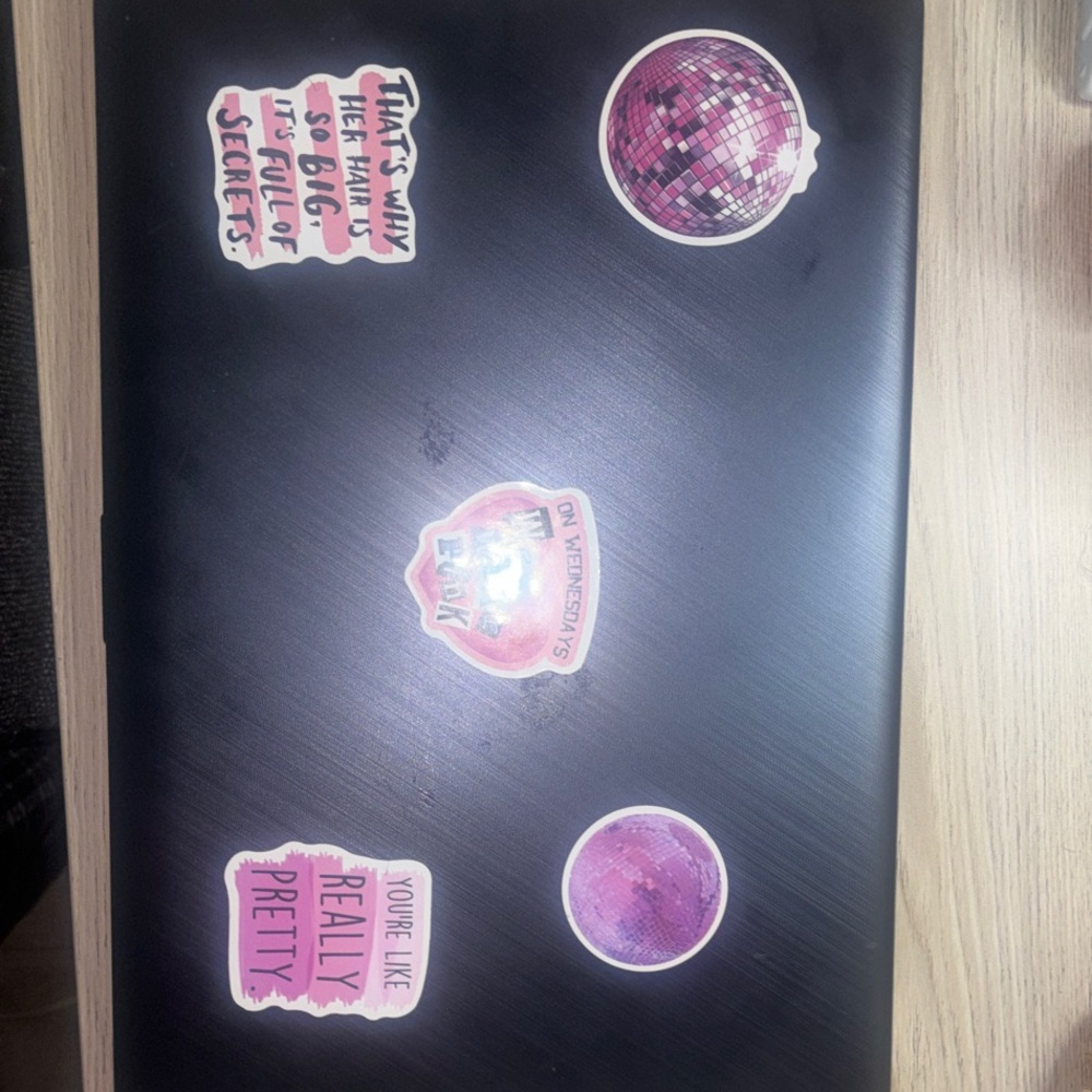 ASUS Black Laptop with Stickers